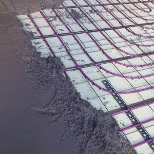 close up of screed hydronic floor heating pipe being covered by screed