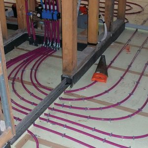 hydronic floor heating pipe pinned to insulation