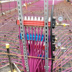 hydronic floor heating pipe in slab plumbed back to large manifold