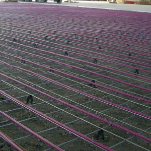 close up of hydronic floor heating pipe in slab